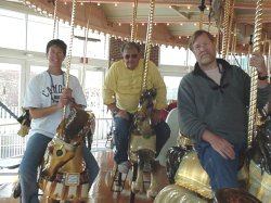 Dale, Bob and Mona on carousel in Hampton